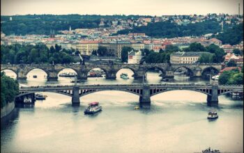 Mánes bridge and Charles bridge in Prague used by pedestrians, cars and tramways. The arch bridges over river Vltava (Moldau) connects the Prague districts Mala Strana and the Old Town.